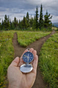 hand holding compass